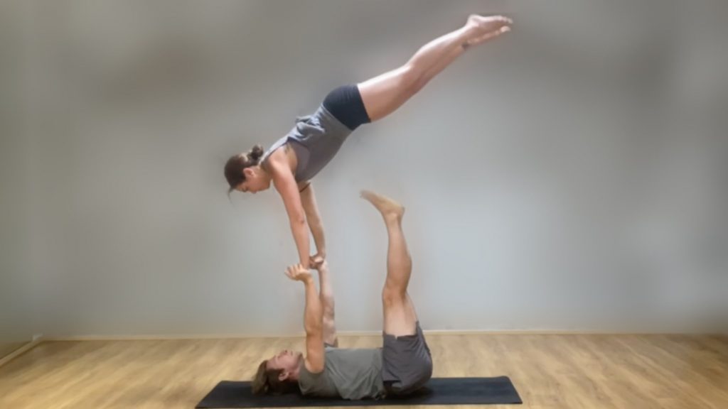Marie mid straight pop, hands connected to Tomas' hands